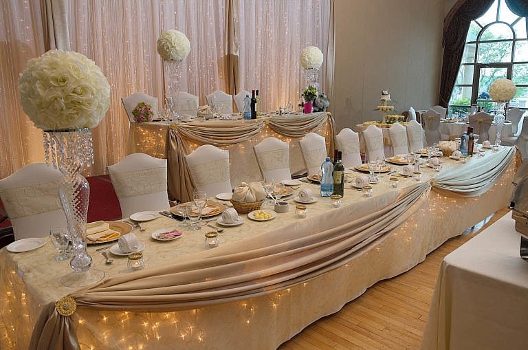 elegant head table at royal ambassador wedding