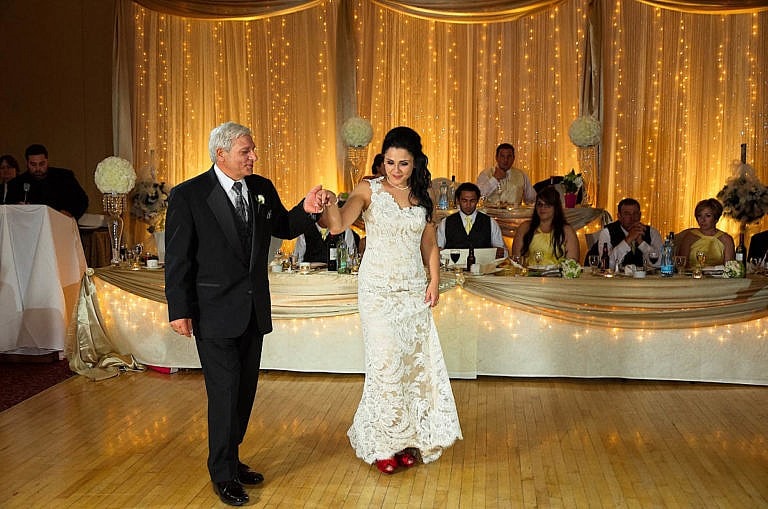 Bride dances with her father at Royal Ambassador wedding reception