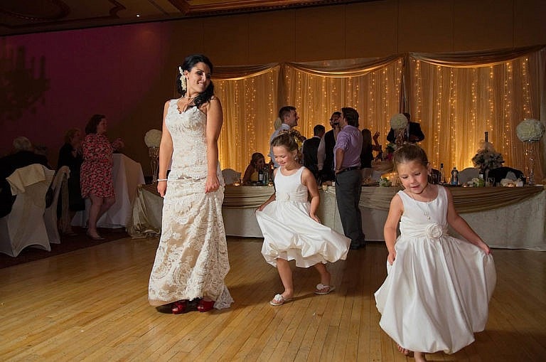 bride dances with flower girls at wedding reception at Caledon wedding