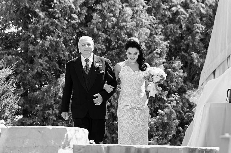 Bride walks down the aisle with her father at Royal Ambassador Caledon wedding