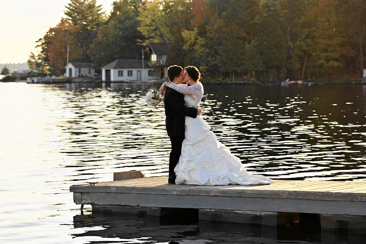 bride and groom on dock at viamede resort wedding