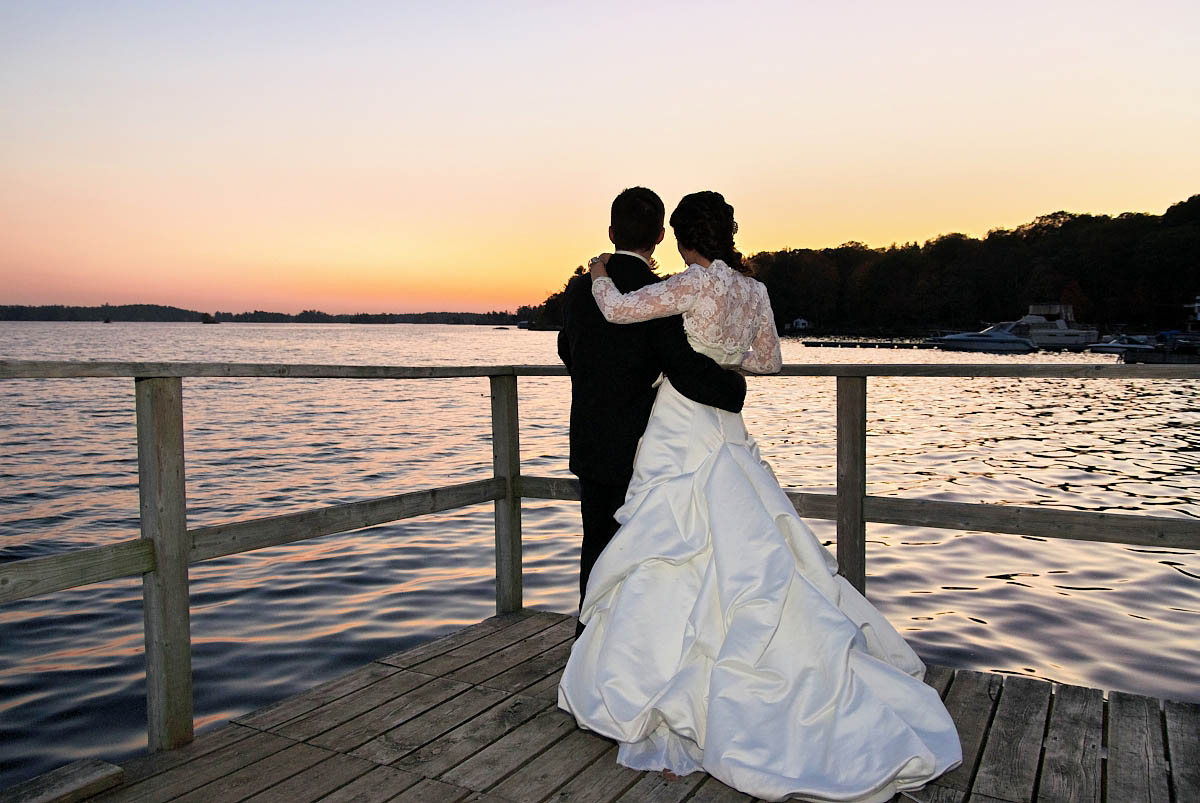 bride and groom on dock at night at viamede resort wedding