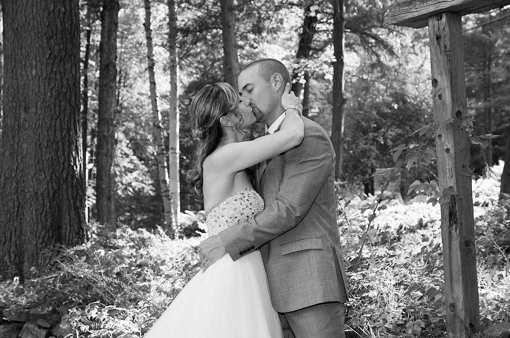 wedding couple kissing in forest haliburton wedding photography
