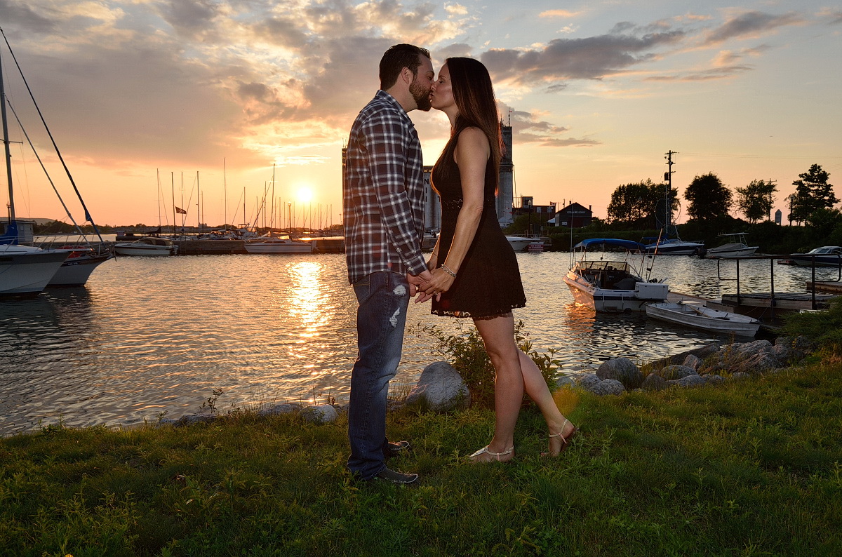 Couple kisses at sunset in front of Collingwood Yacht Club