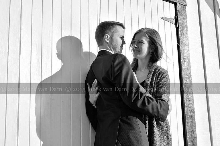 Leaning against the Leacock Museum boathouse during an Orillia engagment session
