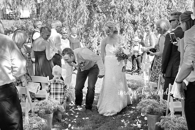 Groom stops to Shake Hand of Young Boy During Recessional