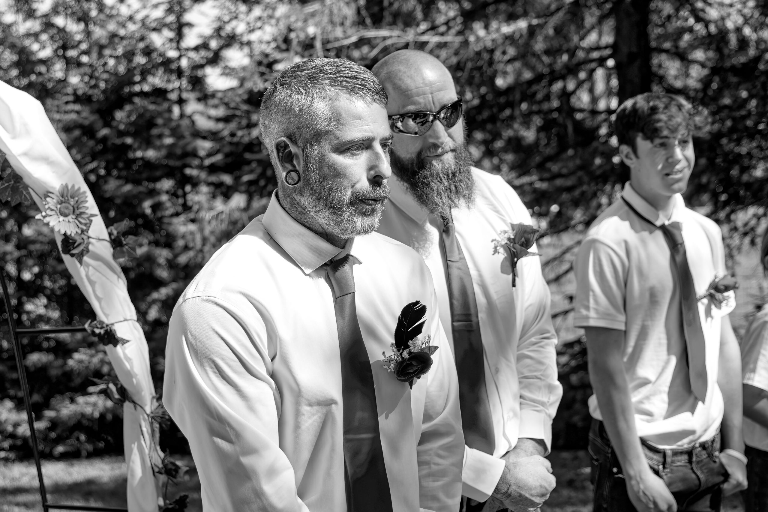 Grooms lets out a whistle when he sees his bride coming down the aisle at outdoor wedding near Huntsville, Ontario
