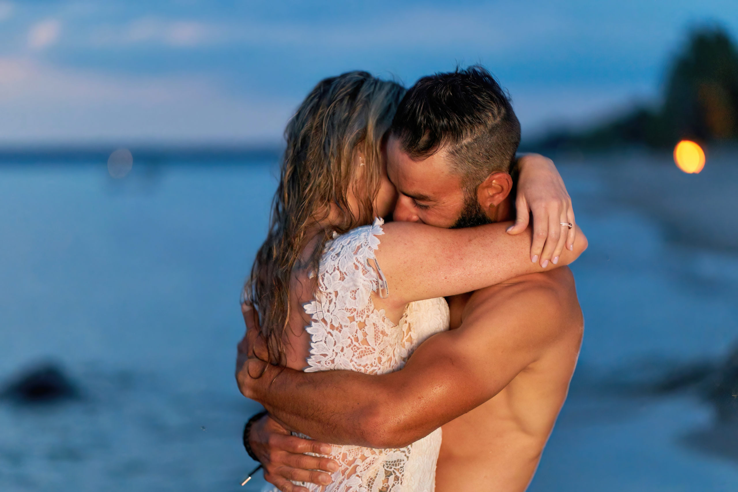 Husband and Wife Embrace at Twilight at Beach During Georgian Bay Trash the Dress Session