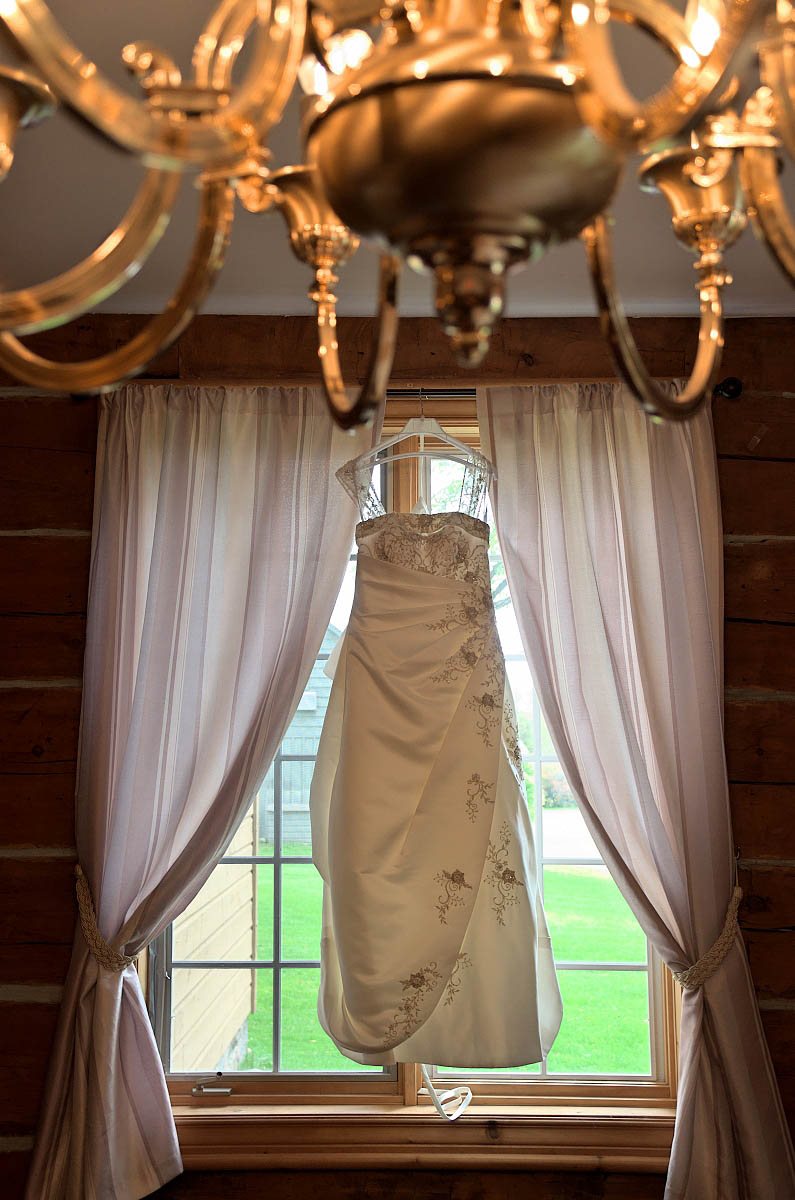 Wedding dress hanging in window of Dunsford House at Eganridge Resort in Fenelon Falls