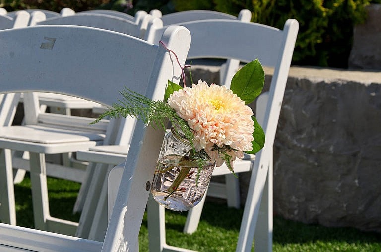 wedding chairs with flowers