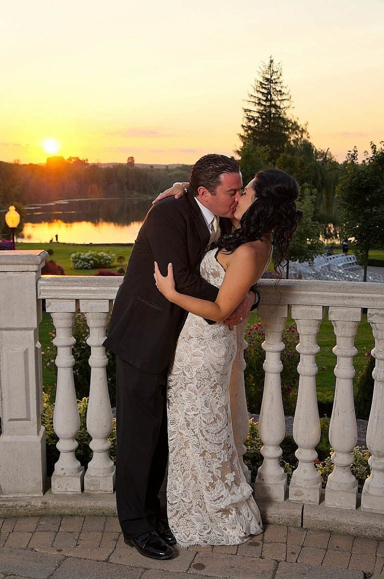 bride and groom kiss at sunset in garden at Royal Ambassador wedding in Caledon