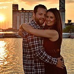 Couple embraces at sunset in front of Collingwood terminals at Collingwood photography session