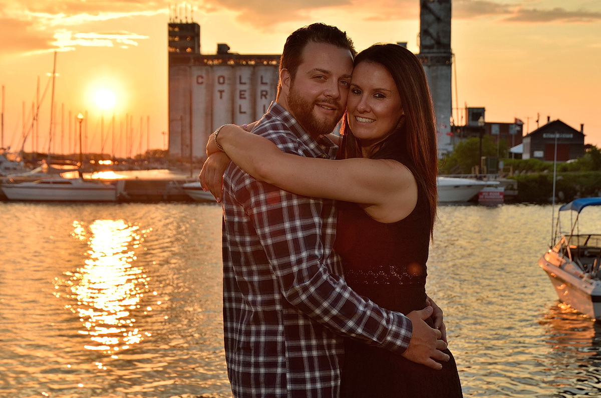 Couple embraces at sunset in front of Collingwood terminals at Collingwood photography session