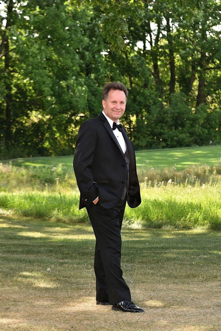 Handsome groom on golf course at Bond Head wedding