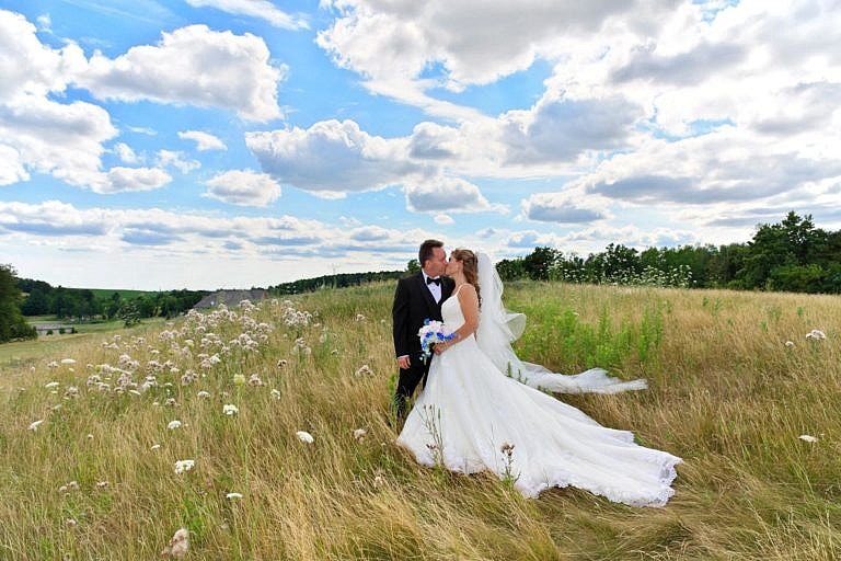 Bride and Groom in meadow at The Club at Bond Head wedding