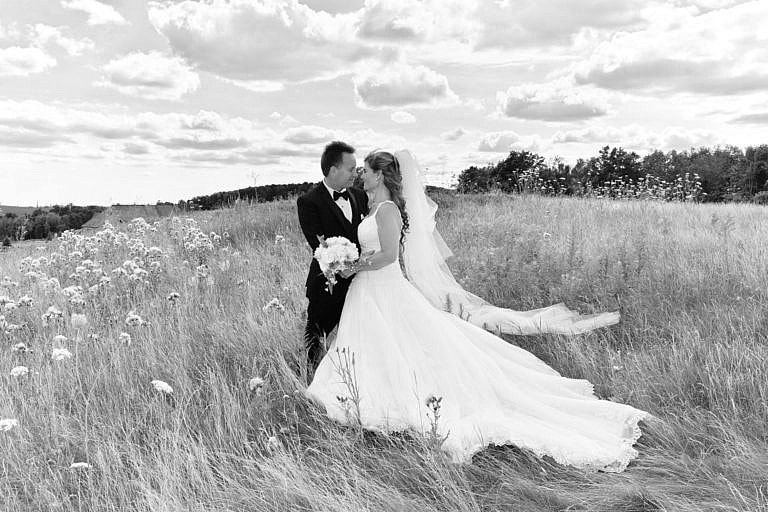 Bride and Groom in meadow at The Club at Bond Head wedding