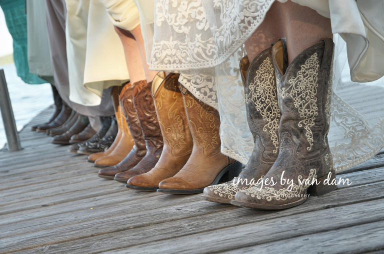 close up of bridesmaids wearing cowboys, standing on dock