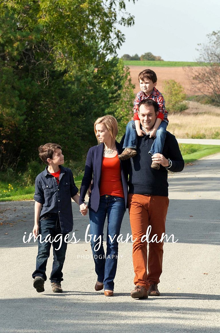Young Family Walks Down Country Road stayner photographer barrie photographer family portraits wasaga photographer collingwood photographer