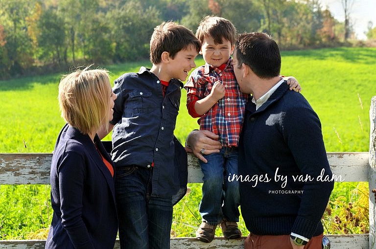 A Young Family Shares a Moment of True Affection at the Farm stayner photographer barrie photographer family portraits wasaga photographer collingwood photographer