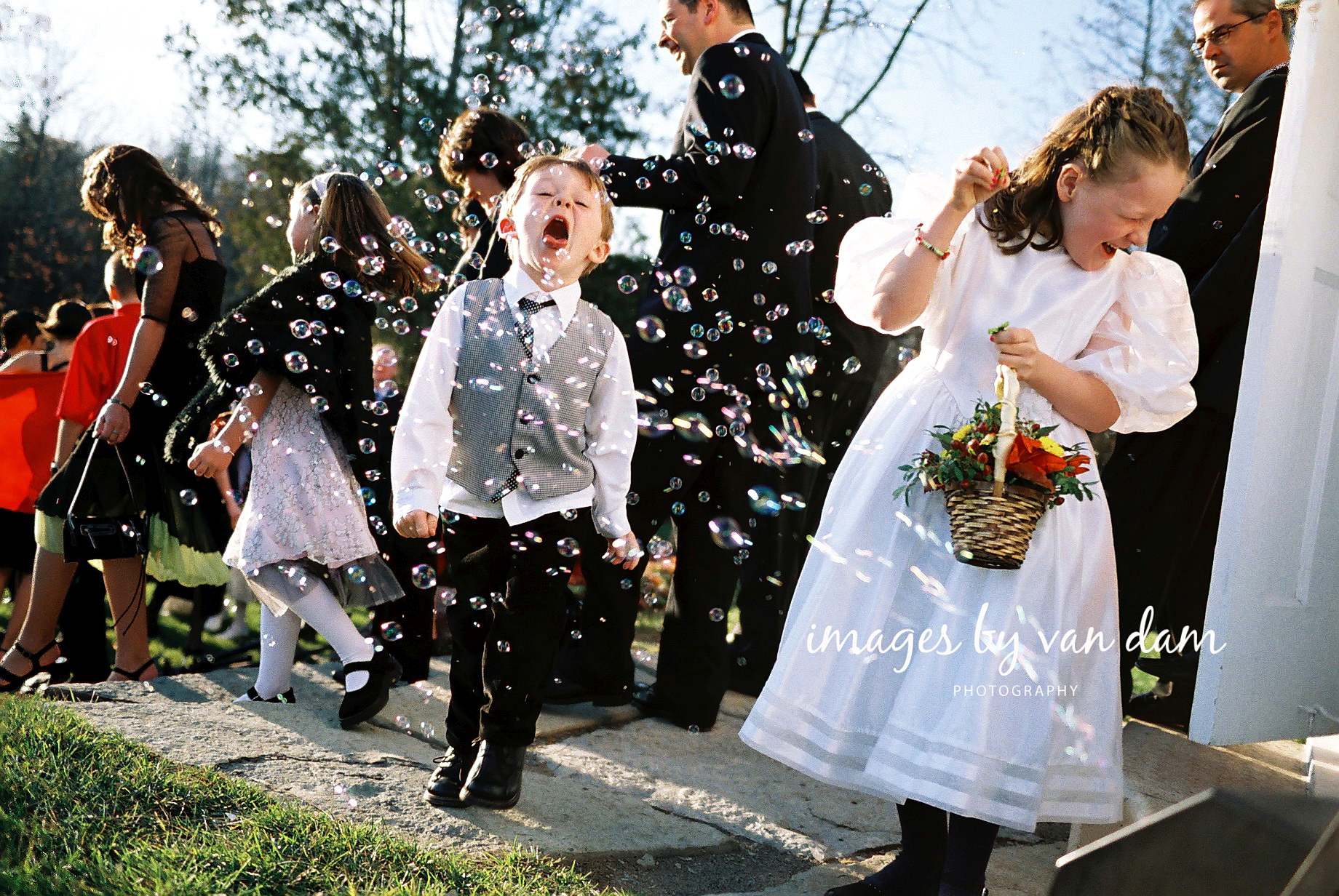 Boy catches bubbles with his mouth at Peterborough wedding