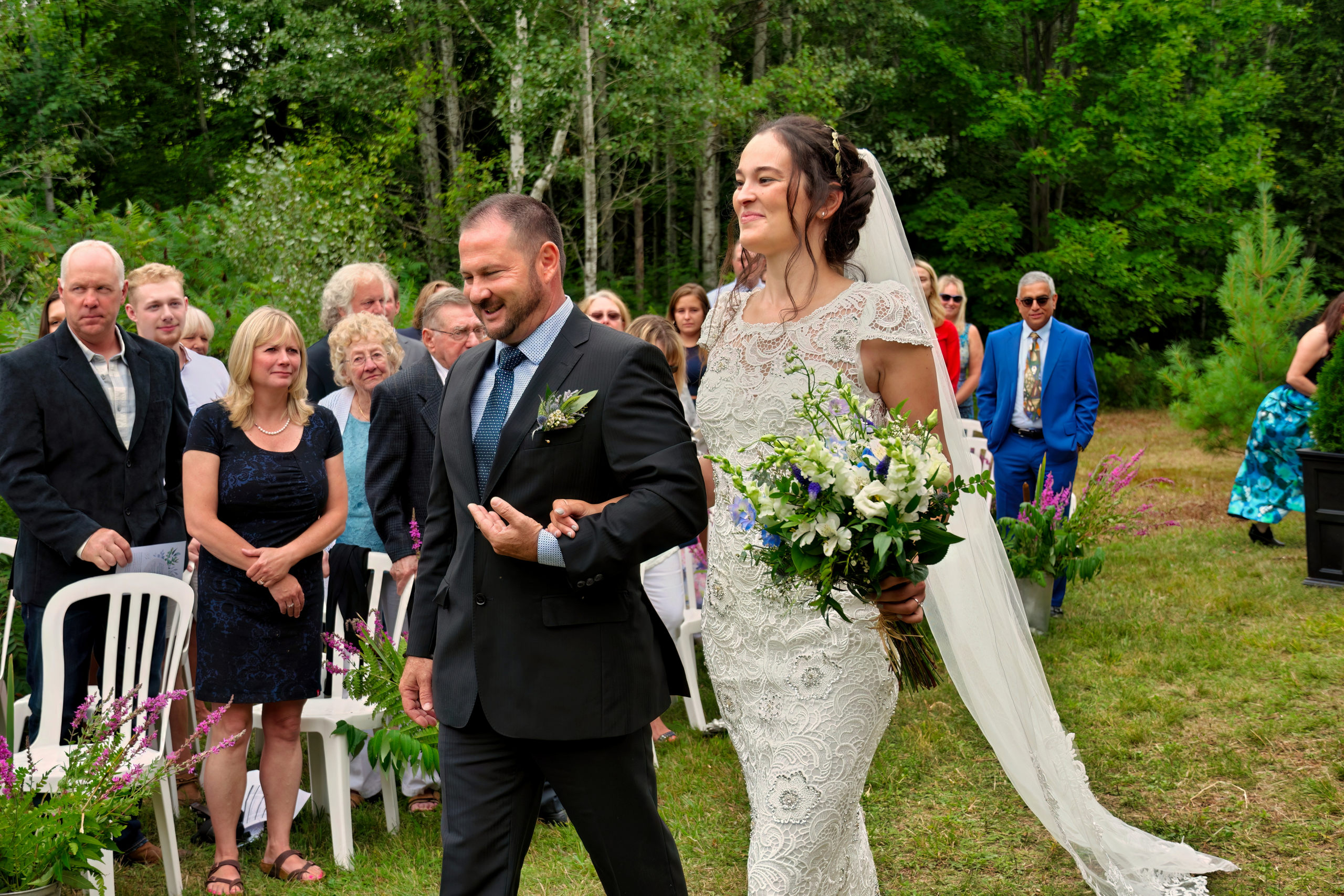 Bride Walking down Aisle with Her Father at Outdoor Wedding