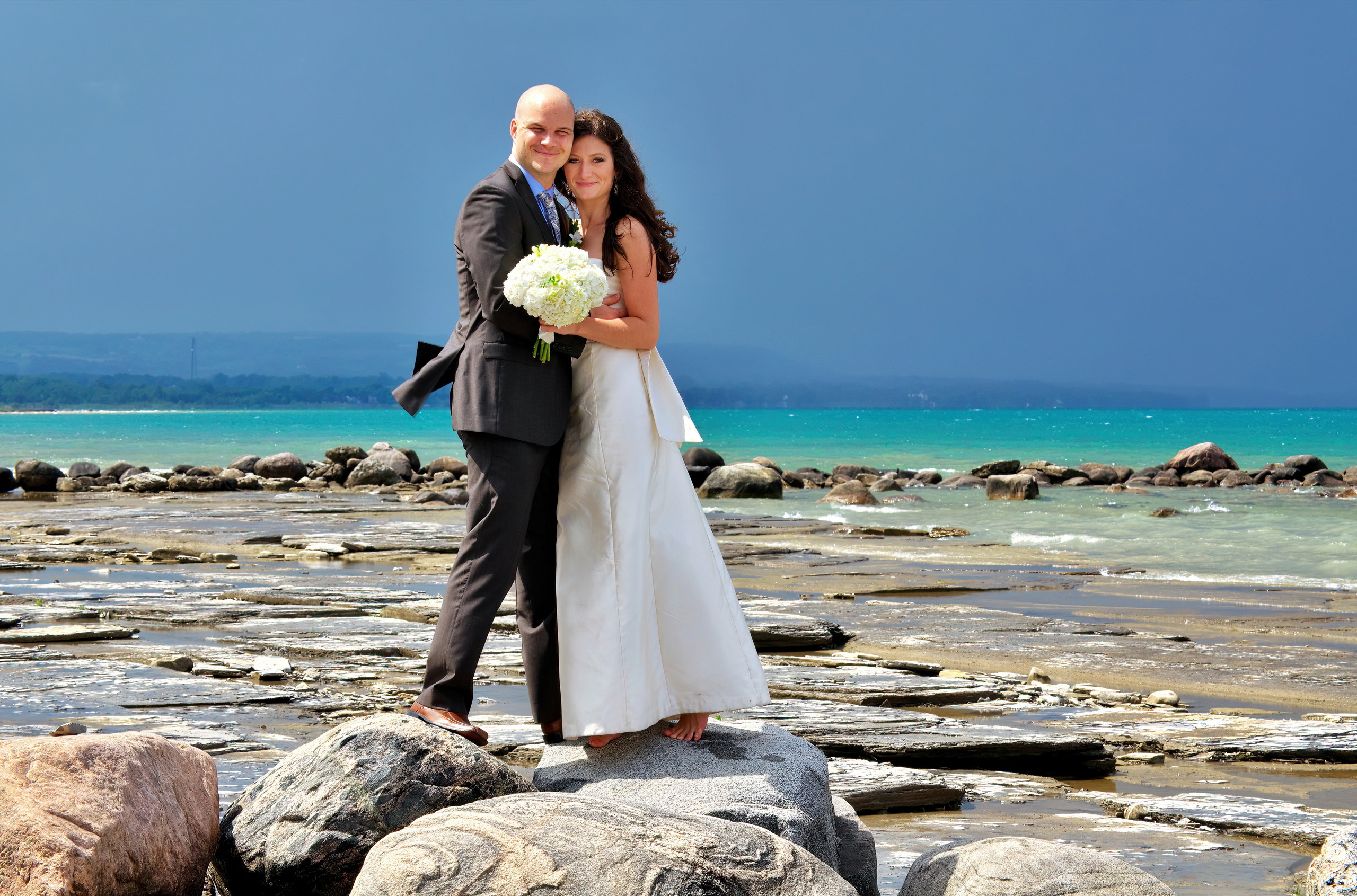 Wedding Couple on Rocky Craigleith Beach before a Summer Storm