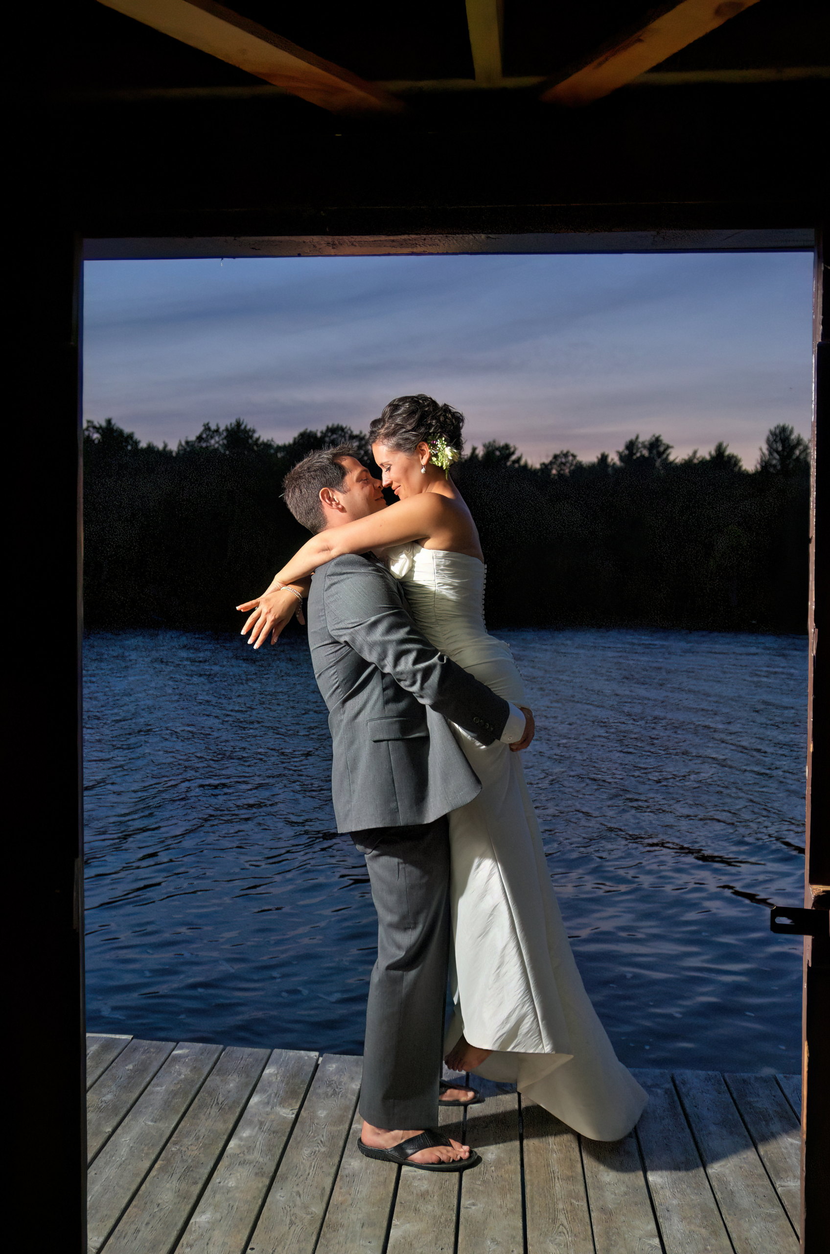 Bride and Groom share a moment alone on the boathouse dock